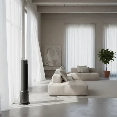 An oscillating tower fan strategically placed in a large, modern living room corner, sweeping air across the space.